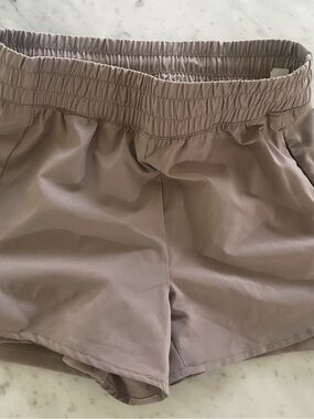 Women’s REEBOK athletic shorts with compression shorts built in.